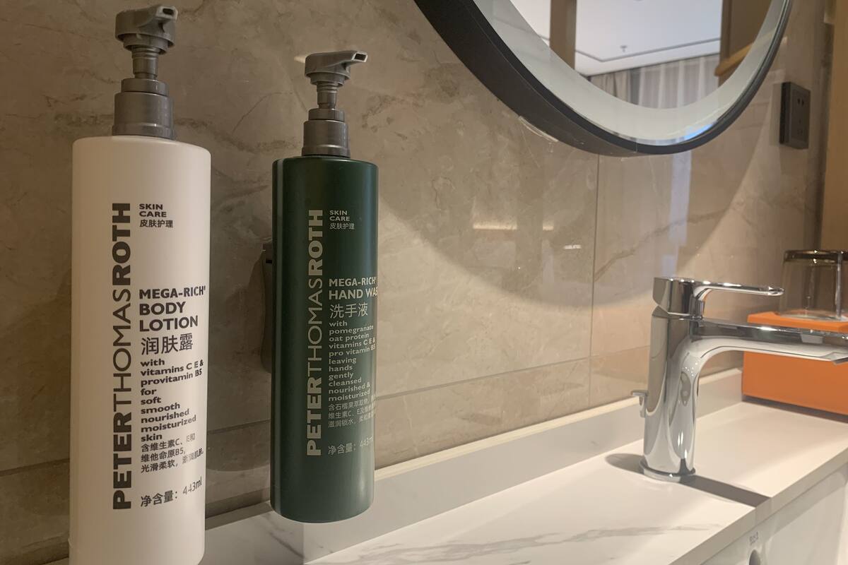 Two bottles of Peter Thomas Roth skincare products on a bathroom counter.