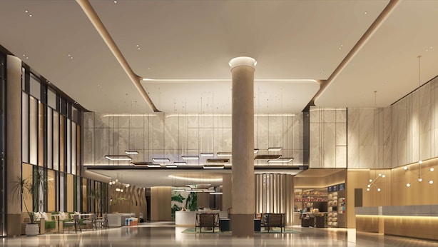 A spacious lobby with a central column, seating areas, and a reception desk. - Hilton Garden Inn Anshan Haicheng (Anshan)