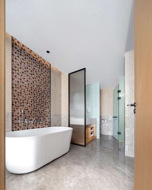 A modern bathroom with a freestanding bathtub, a glass shower enclosure, and a marble-tiled floor. - Hilton Garden Inn Changsha Yuelu (Changsha)