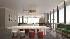 A modern interior with a central island, seating areas, and large windows offering city views. - Hilton Garden Inn Shenzhen Airport (Shenzhen)