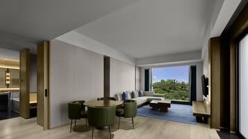 King Premium Suite | Living area | 55-inch Smart TV with digital channels, toys, books