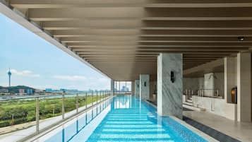 Indoor pool, open 8:00 AM to 10:00 PM, pool loungers, lifeguards on site