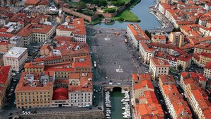 An aerial view of a city with historic buildings, a central square, and a canal. - Studio nearby Hospital and Train railway. (Livorno)