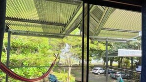 A room with a view of a parking area and greenery outside. - Terrazas del Golfo Oceanfront, Room La Lapa! Pet Friendly! (Provincia de Puntarenas)