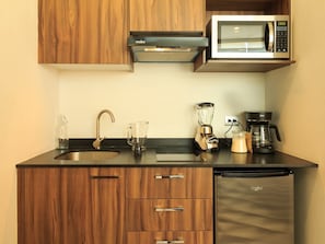 Microwave, stovetop, coffee/tea maker, cookware/dishes/utensils