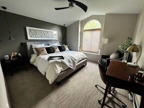 A bedroom with a bed, bedside tables, a desk, and a window with blinds. - Luxury 3BR Home, Comfy 🛌, WiFi, Quiet, Near (Boise)