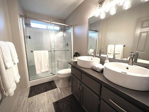 Combined shower/tub, hair dryer, towels, soap