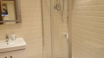 Shower, hair dryer, towels, soap