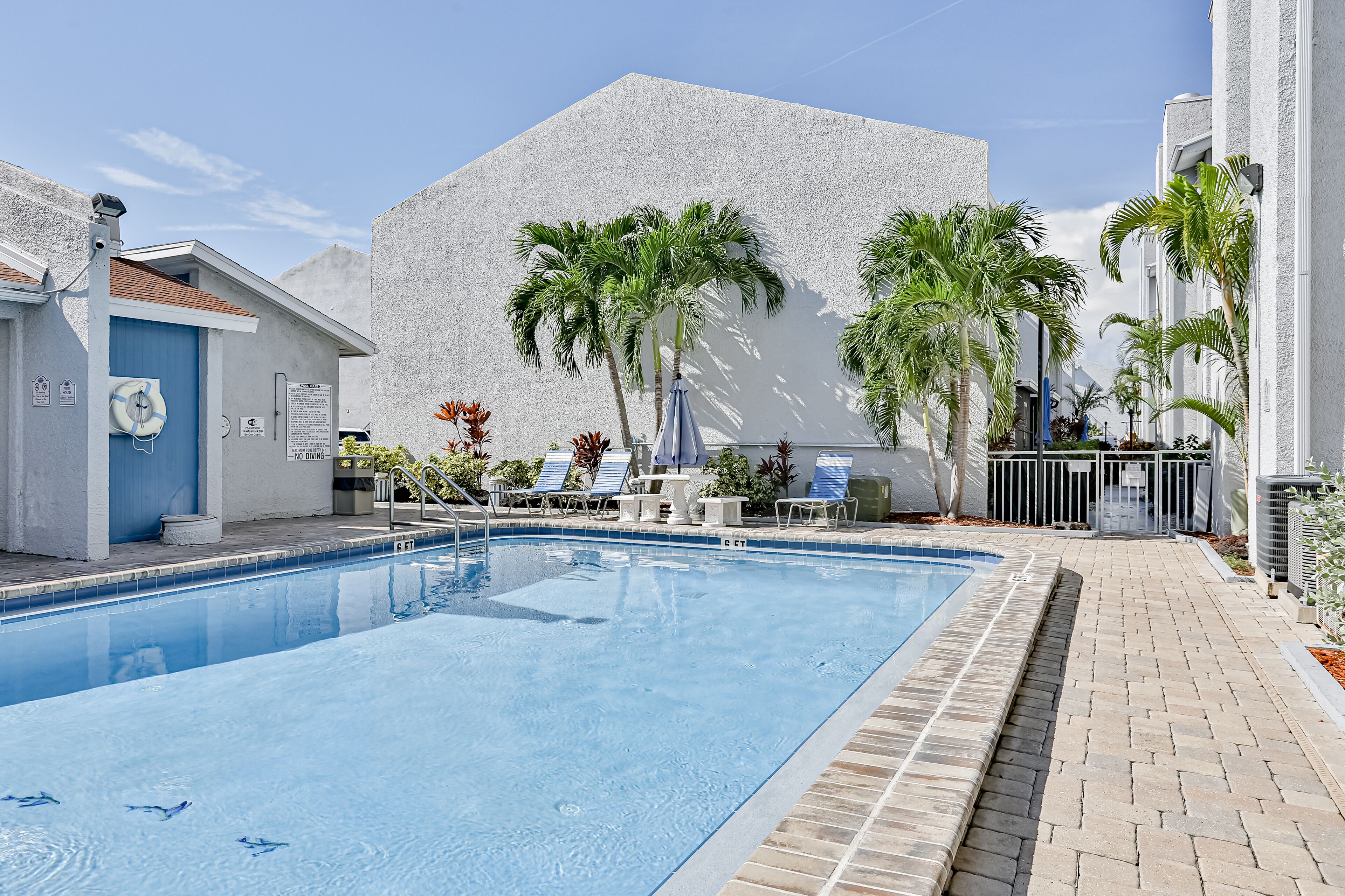 Water-view condo with balcony, pool & W/D - walk to beach