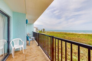 Enjoy the ocean view from this balcony with a clear view of the beach and surrounding landscape.