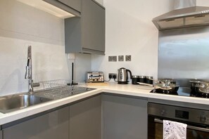 Fridge, stovetop, dining tables