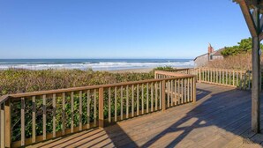 A wooden deck with a railing overlooking a beach. - New Listing! Cozy beachfront home on famed Heceta Beach, amazing sunsets (Florence)