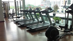 A gym with treadmills, exercise bikes, and a rowing machine. - Industrial Suites at Bandar Sunway (Petaling Jaya)