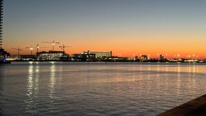 A waterfront view with buildings and construction cranes. - Spacious 4-bedroom house with WiFi, Pool, Six TVs, AC in enjoyable Naples (Naples)