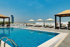 Outdoor pool, open 8:00 AM to 8:00 PM, pool umbrellas, pool loungers - Four Points by Sheraton Production City, Dubai (Dubai)