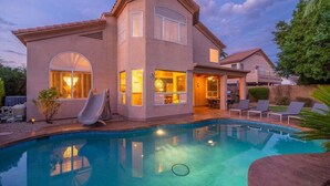 A house with a swimming pool, a patio with lounge chairs, and a covered outdoor area. - Sweet Escape l Heated Pool l Luxury Living (Scottsdale)