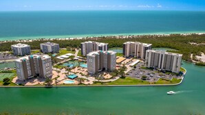 A coastal hotel complex with multiple high-rise buildings, a marina, and a beach. - 8th Floor Oceanview! Large Balcony ~ Steps to Vanderbilt Beach (Naples)