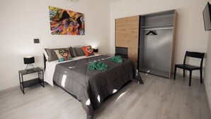 Ein modernes Schlafzimmer mit Bett, Kleiderschrank, Stuhl, Gemälde und Nachttisch.