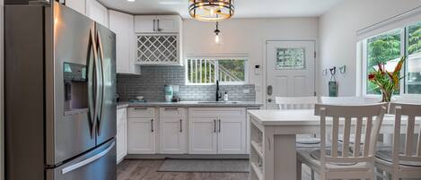 Fridge, microwave, coffee/tea maker, cookware/dishes/utensils