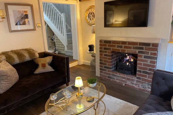 LOUNGE WITH OPEN GAS FIRE, TV WITH SKY, DOUBLE SOFAS, REDMOTE CONTROLLED LIGHTNG