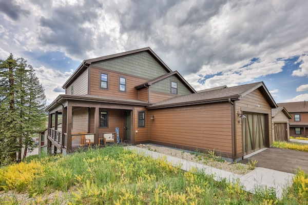 Wrap around front porch with chairs and views all around.