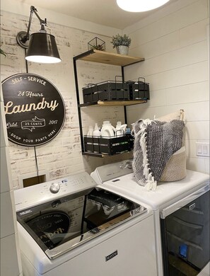 Convenient self-service laundry station available 24/7.