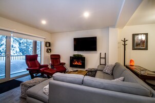 Magog Condo | Living area | 40-inch Smart TV with digital channels, TV, fireplace