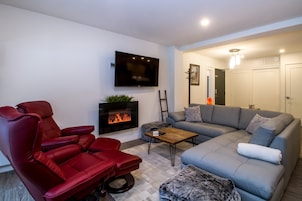 Magog Condo | Living area | 40-inch Smart TV with digital channels, TV, fireplace