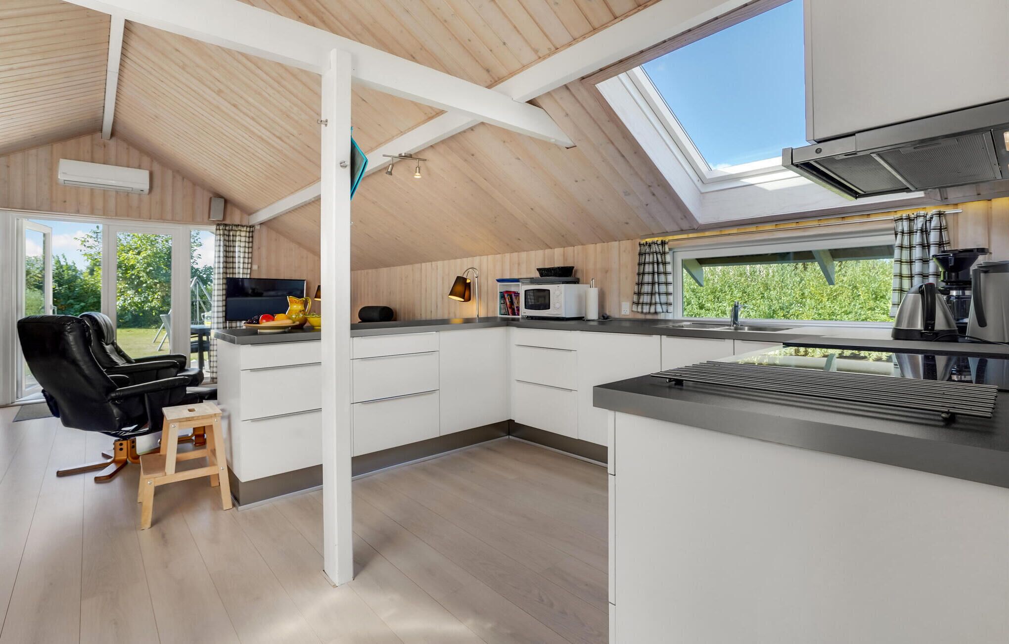 Fridge, stovetop, dishwasher, coffee/tea maker