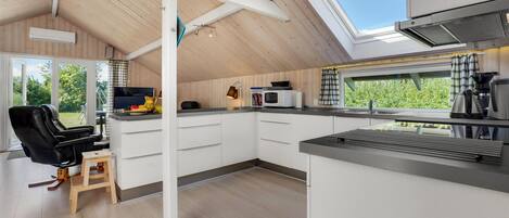 Fridge, stovetop, dishwasher, coffee/tea maker