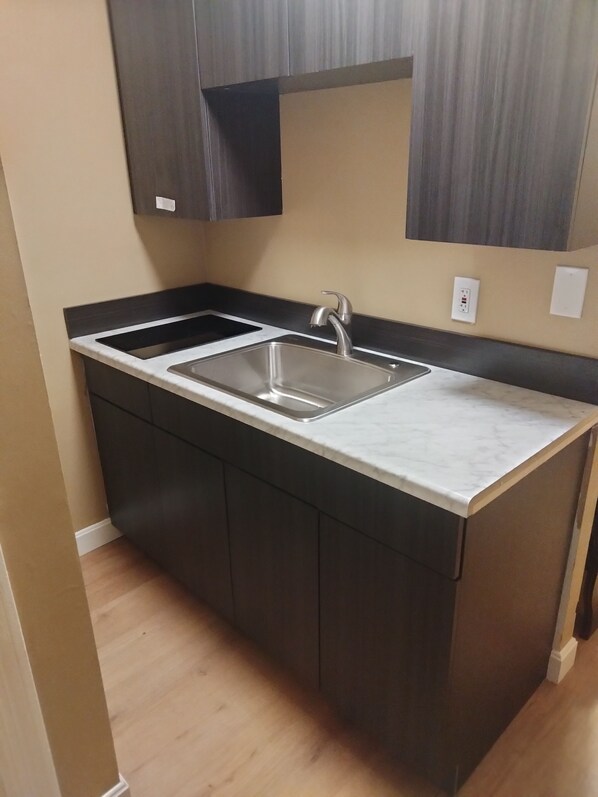 Fridge, microwave, stovetop, dining tables