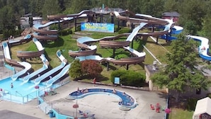 A water park with multiple slides and a central sign for 'Birch Bay Waterslides'.