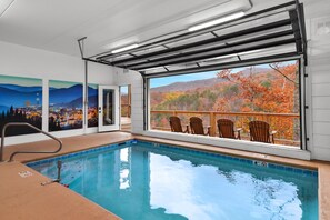Indoor pool, a heated pool - Smoky Mtn Masterpiece ~ Luxury 6BR w/ pool, epic theater, gameroom & views! (Sevierville)