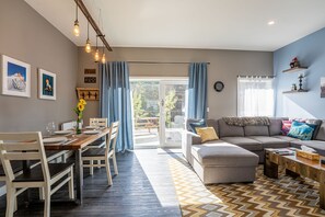 Pillow Top Condo | Living area | 40-inch flat-screen TV with digital channels, TV, heated floors - Pillow Top Condo by Revelstoke Vacations (Revelstoke)