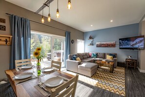 Pillow Top Condo | Living area | 40-inch flat-screen TV with digital channels, TV, heated floors - Pillow Top Condo by Revelstoke Vacations (Revelstoke)