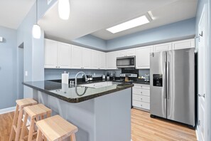 Coffee/tea maker, fridge, microwave, oven