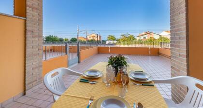 Bright and comfortable apartment, able to accommodate up to 4 people, with a large double bedroom and bedroom with a bunk bed, equipped terrace, living room and kitchenette. Ideal for a relaxing beach holiday, a few meters from the Blue Beach and in a co