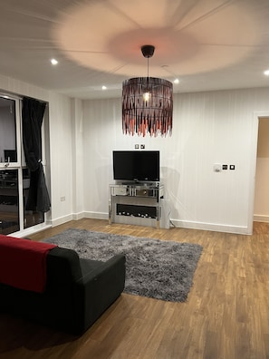 Apartment, 1 Queen Bed | Living room | Fireplace
