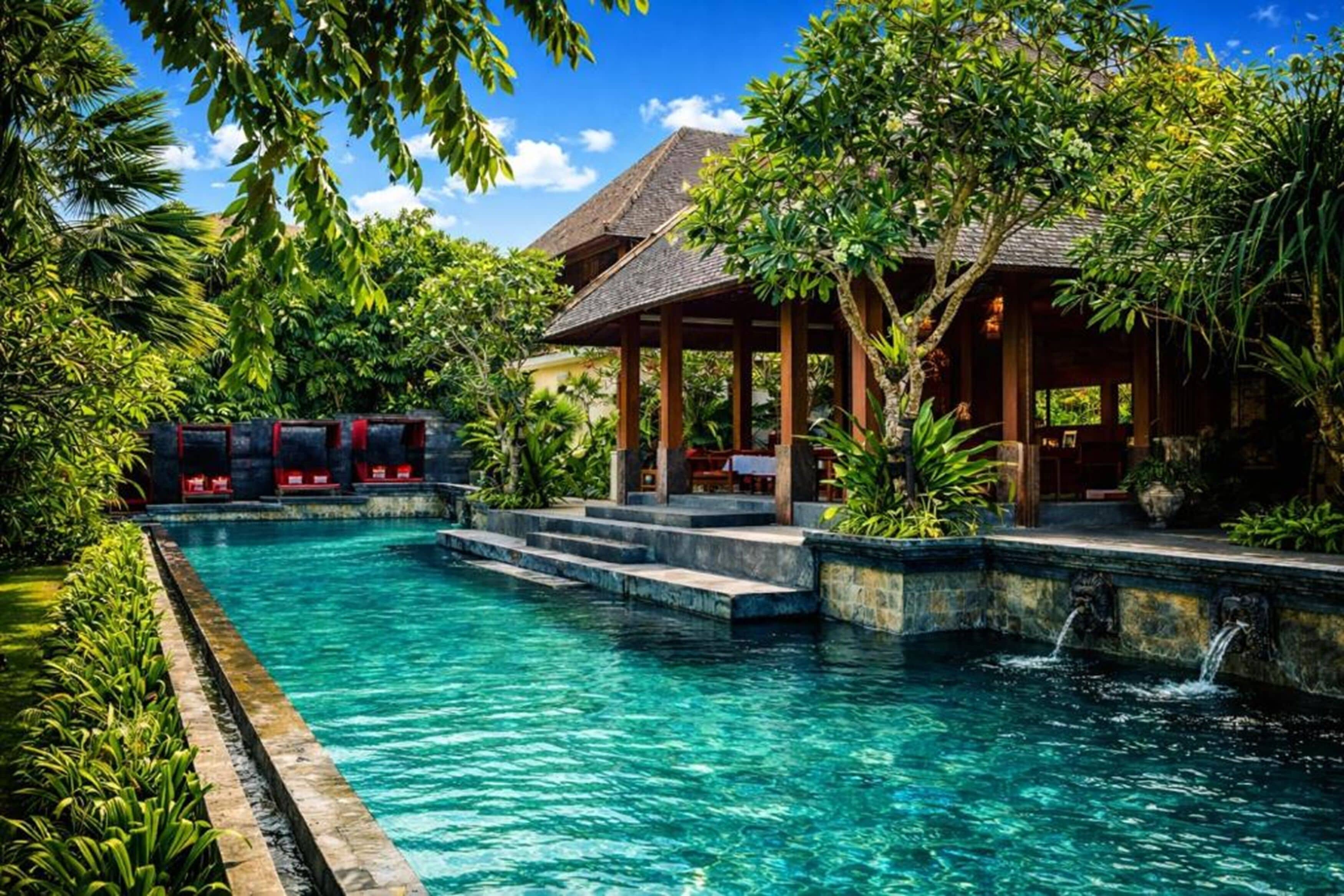 Outdoor pool, open 7:00 AM to 7:00 PM, free cabanas