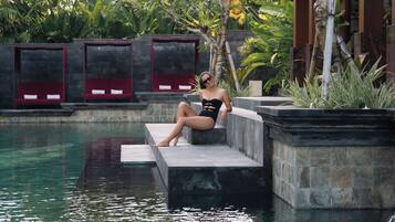 Outdoor pool, open 7:00 AM to 7:00 PM, free pool cabanas