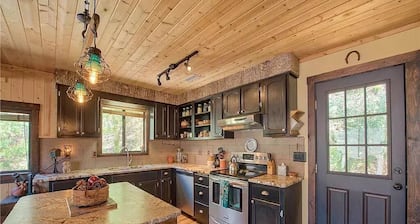 Private retreat with mountain views and a cascading creek on 3 acres. Fast wifi