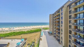 A high-rise hotel with balconies overlooking a beach. - Breathtaking Ocean View, Beachfront Condo-Steps to Beach/Pools, Sea Colony East (Bethany Beach)