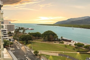 A coastal cityscape with a marina, buildings, and a park. - Seascape: Luxury Waterfront Living in the Heart of Cairns (Cairns City)