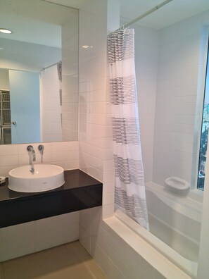 Bathtub, towels, toilet paper