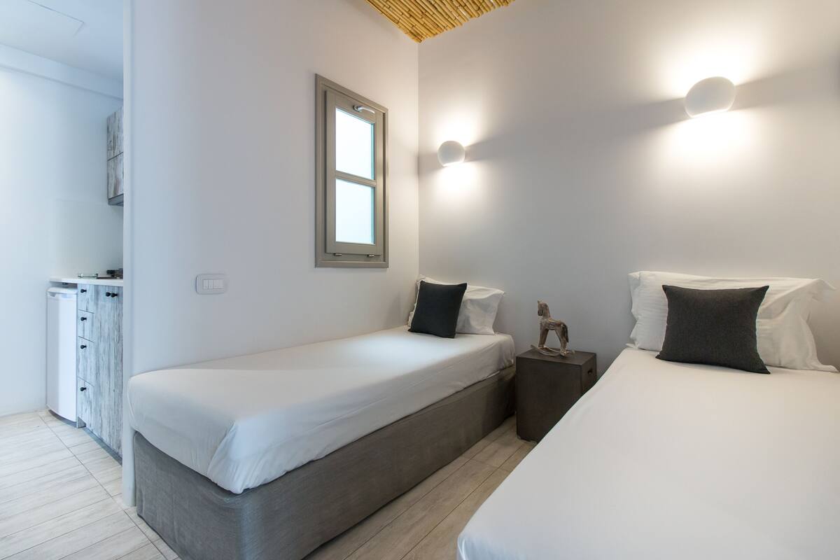 Quadruple Room | 1 bedroom, in-room safe, individually decorated, individually furnished