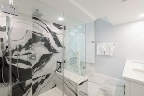 Bathtub, hair dryer, towels, soap