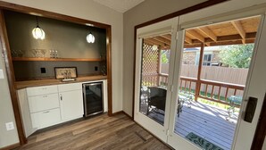 A kitchen with white cabinets, a built-in oven, and pendant lighting. - The Akes house is a great place to relax and let all your aches fade away.  (Cheyenne)