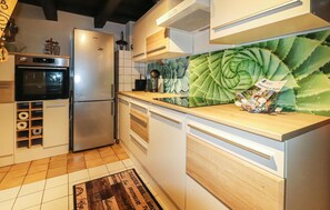 Fridge, stovetop, dishwasher, coffee/tea maker