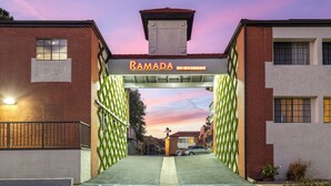 A gated entrance to a building with a sign reading "RAMADA BY WYNDHAM". - Fully Furnished Style 2 BHK - 1 BATH Apt in San Diego Poway-Miramar with Parking (Poway)