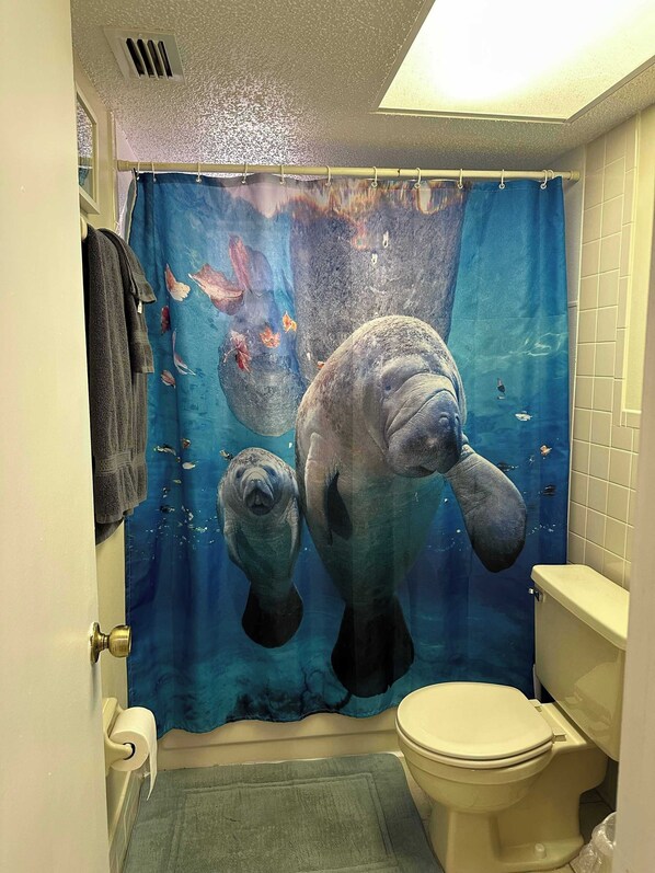 Bathtub, hair dryer, towels